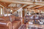 Antler Lodge - Living area, beautiful full log beams and leather furniture.